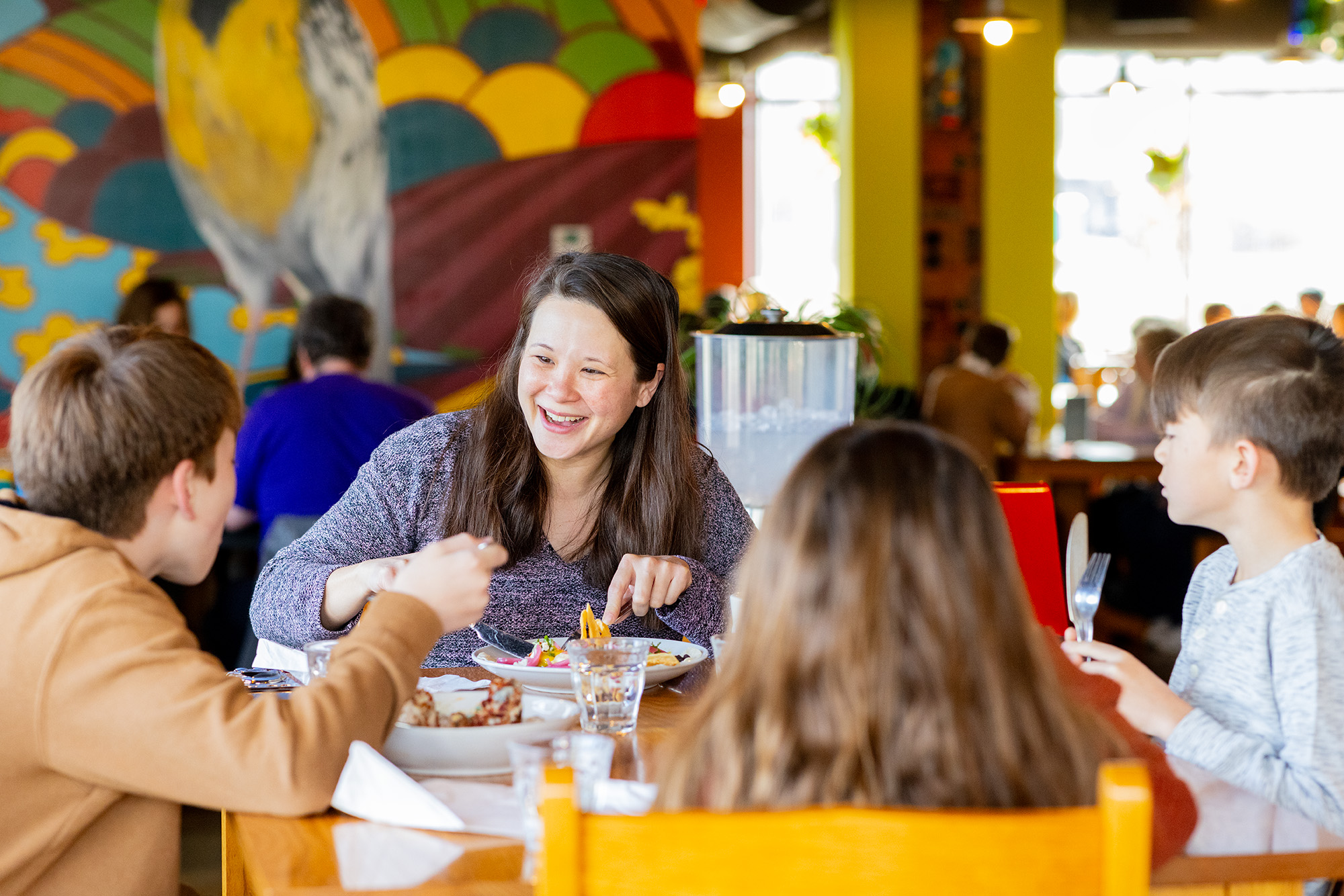 Hub Cafe, family enjoying meal, give the gift of a hub cafe gift card