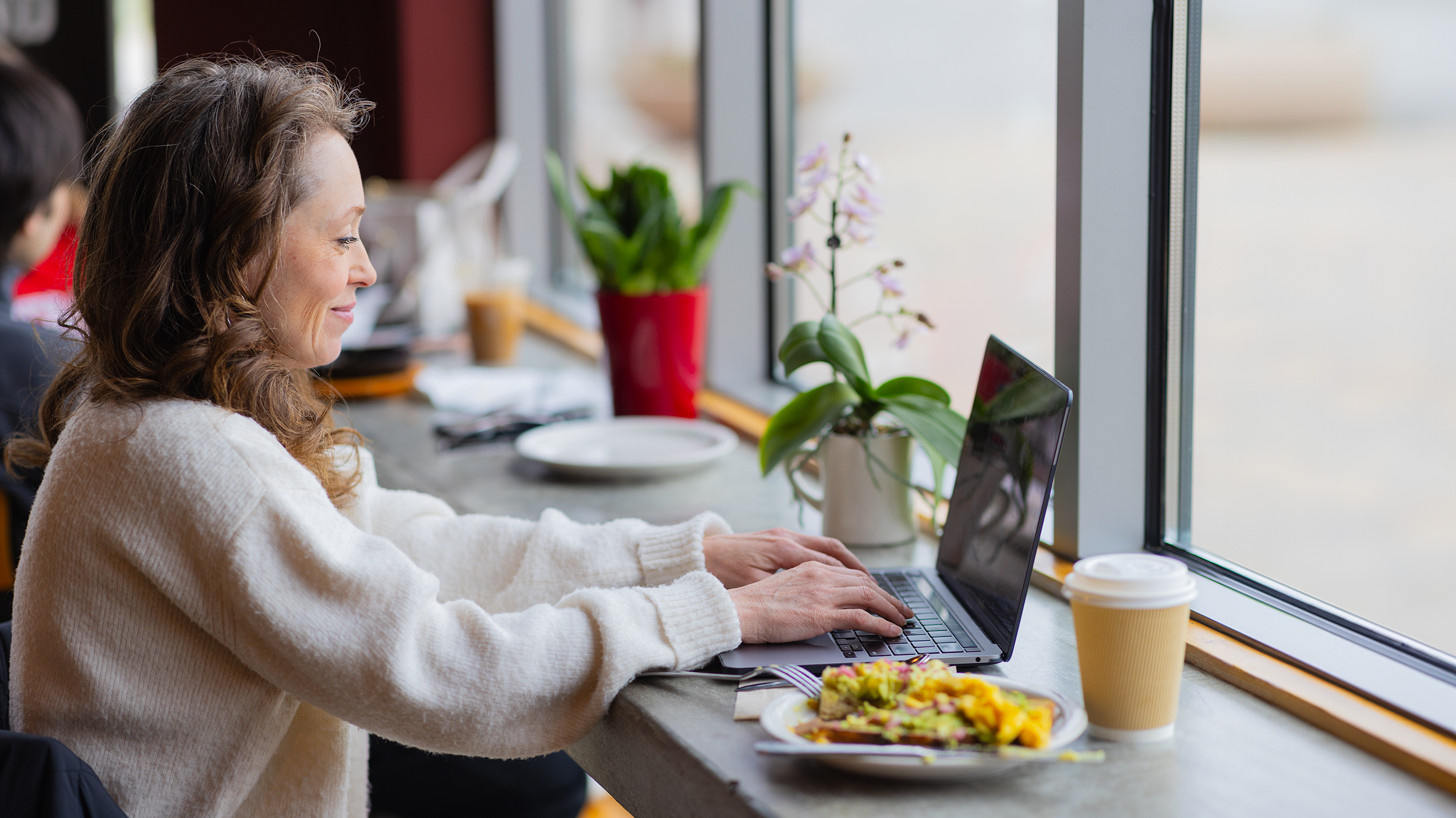 Hub Cafe, Women on laptop, Digital gift card